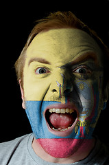 Image showing Face of crazy angry man painted in colors of ecuador flag