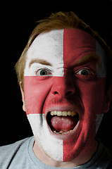 Image showing Face of crazy angry man painted in colors of england flag