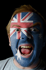 Image showing Face of crazy angry man painted in colors of australia flag