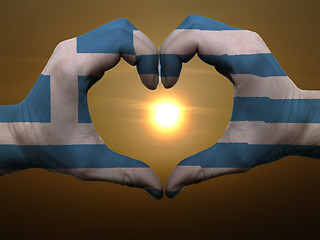 Image showing Heart and love gesture by hands colored in greece flag during be