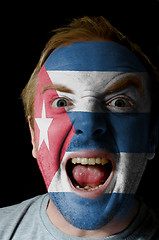 Image showing Face of crazy angry man painted in colors of Cuba flag