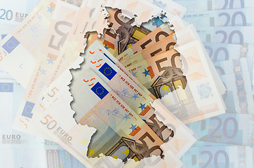 Image showing Outline map of Germany with transparent euro banknotes in backgr