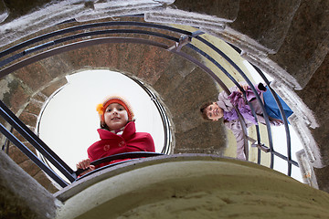 Image showing beautiful young girl with mother on staircase