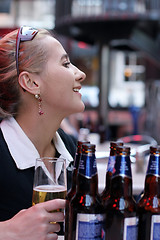 Image showing Girl with beer bottles
