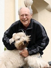 Image showing Happy senior man and his dog