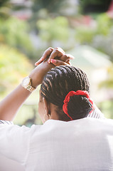 Image showing Caribbean African woman with cornrow braids 