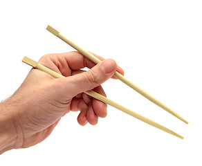 Image showing using chopsticks