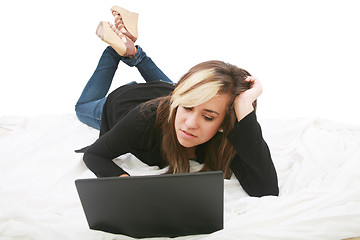 Image showing Beautiful isolated teen laptop girl on bed