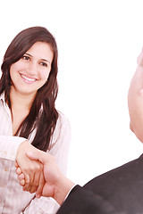 Image showing Closeup of business people shaking hands over a deal at office -