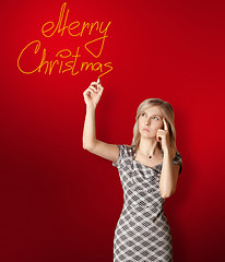 Image showing businesswoman writting Merry Christmas