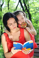 Image showing  Little girl and mother reading the book. 