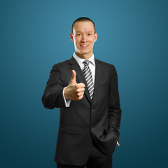 Image showing asian businessman in black suit shows well done