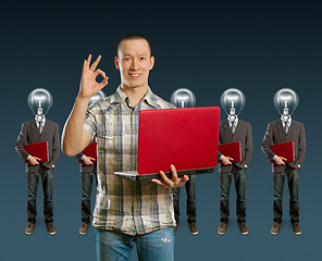 Image showing lamp head businesspeople with laptop