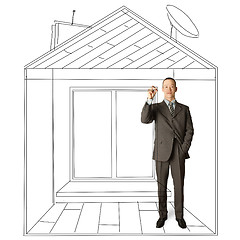 Image showing asian businessman with marker in fictional house