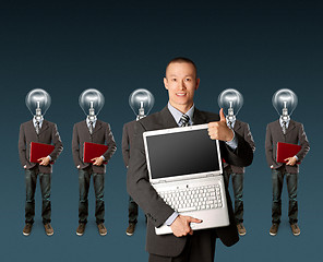 Image showing lamp head businesspeople with laptop