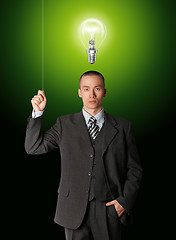 Image showing business man turn on the light