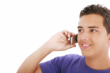 Image showing young smiley man speaking on his mobile. isolated on white, copy