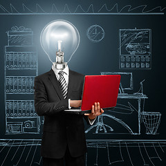 Image showing lamp head businessman with laptop