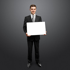 Image showing businessman with empty write board