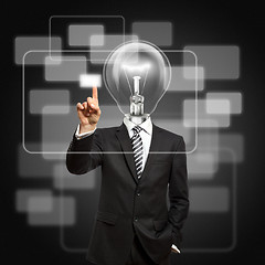 Image showing businessman with lamp-head push the button