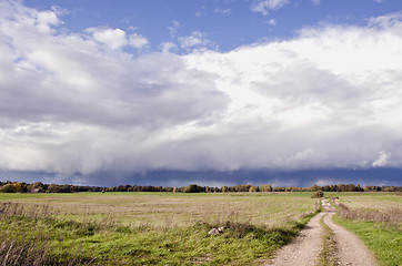 Image showing Agricultural fields in autumn and gravel road.