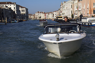 Image showing Man in a water taxi in Venice