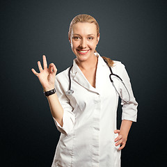 Image showing young doctor woman shows ok