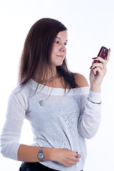 Image showing Pretty woman talking by mobile phone