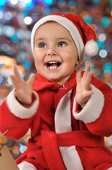 Image showing happy Christmas clapping baby girl