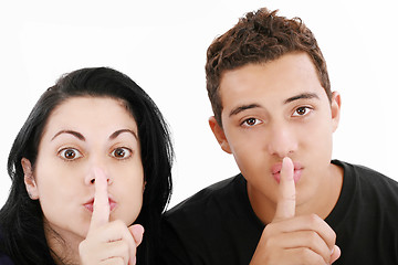 Image showing Friends or couple showing silence sign. Isolated on white