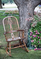 Image showing Rocking chair and flowers