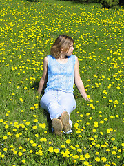 Image showing Girl on dandelion lawn