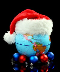 Image showing Globe Santa hat and Christmas balls.