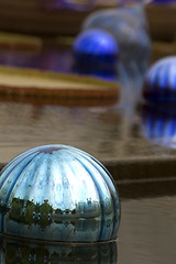 Image showing pond with blue glass piece