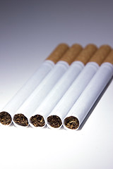 Image showing Isolated Cigarettes Under Blue Light