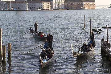 Image showing Three gondolas with passengers.