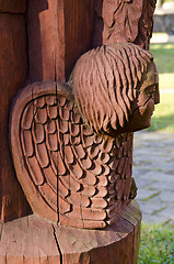 Image showing Cracks in wooden sculpture head closeup.