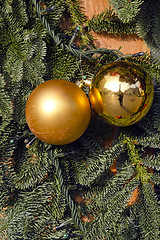 Image showing Christmas yellow toys, plastic branches imitation.