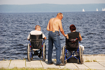 Image showing Disabled people in wheelchairs on the embankment