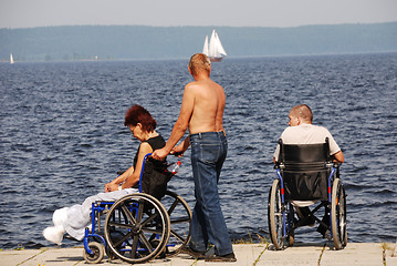 Image showing Disabled people in wheelchairs on the embankment