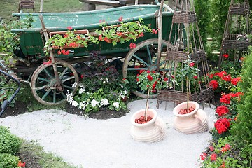 Image showing old wooden cart with flowers