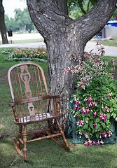 Image showing Rocking chair and flowers