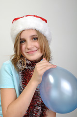 Image showing cute xmas girl with a balloon