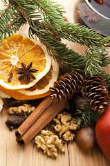 Image showing Different kinds of spices, nuts and dried oranges - christmas de