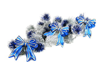 Image showing Christmas garland with blue ribbons.