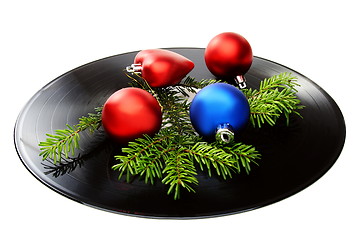 Image showing Christmas still life with a vinyl disc and balls.