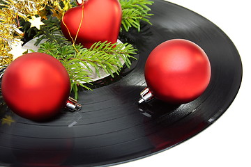 Image showing Christmas still life with a vinyl disc and balls.