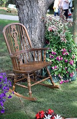 Image showing Rocking chair and flowers