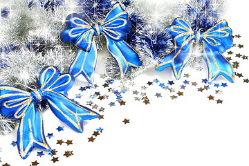 Image showing Christmas garland with blue ribbons.