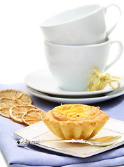 Image showing Sandy pastry with lemon filling and teacups.